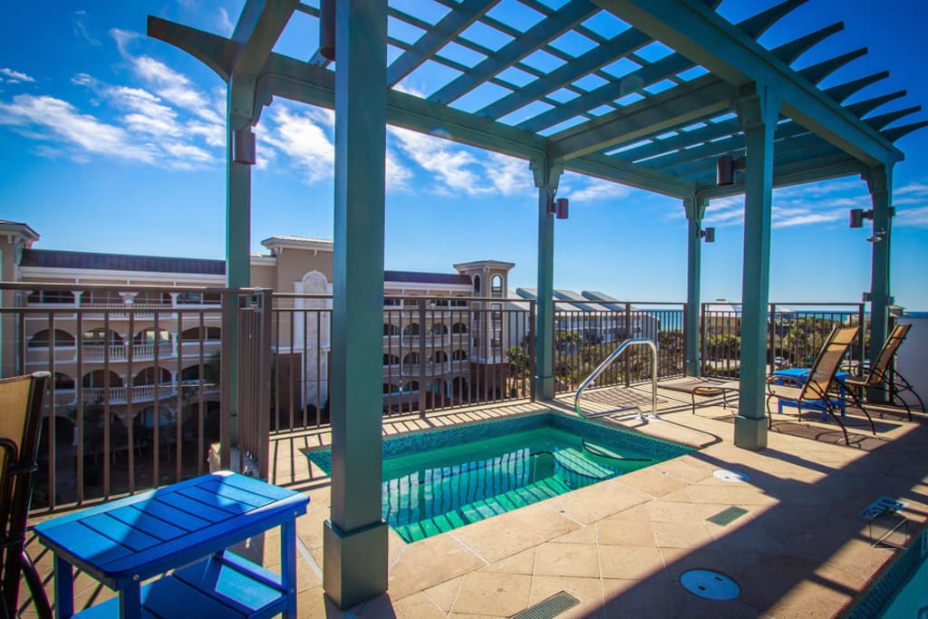 The hot tub, located on the rooftop deck, also features Gulf views.
