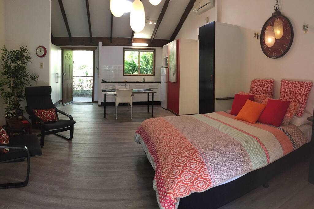 Comfortable bed in roomy studio