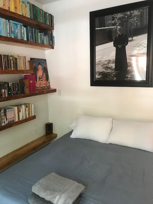 View of the bed, with photo of Francesco Clemente