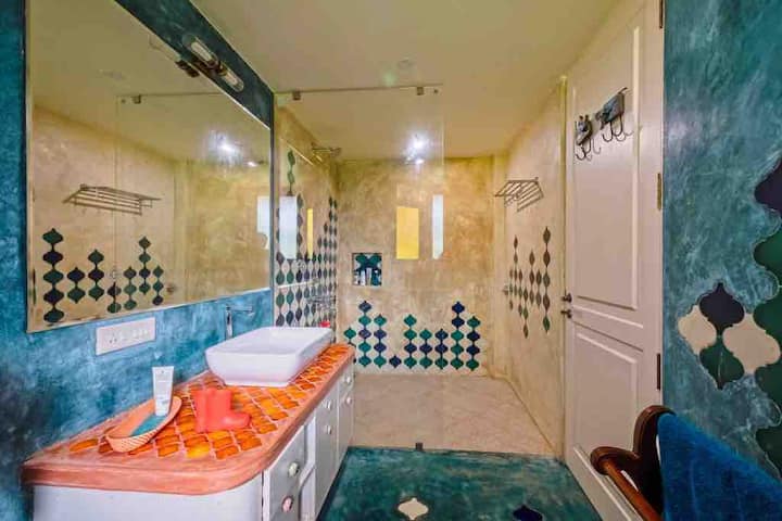 The bathroom here is delightful and is loved by guests due to their size and eclectic design. One of them said that he can stay in the bathroom the whole day and read !