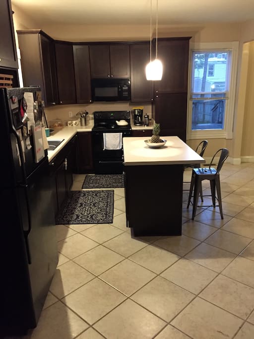 Large eat-in kitchen with dining table and bar