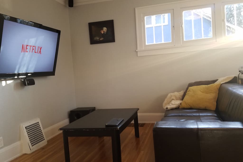 The TV is hooked up to a home theater PC. Hop on and access any of your online video accounts (Netflix, Amazon, Hulu, Youtube, etc). The TV is on a large swing arm so it can be viewed from the dining room as well.