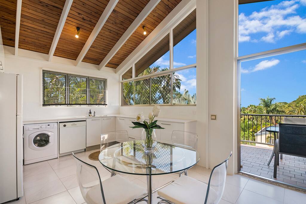 Sunny Kitchen with dishwasher and washing machine.