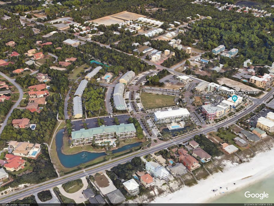 Gulf Place Caribbean is lower left building by pond and green slate roof.