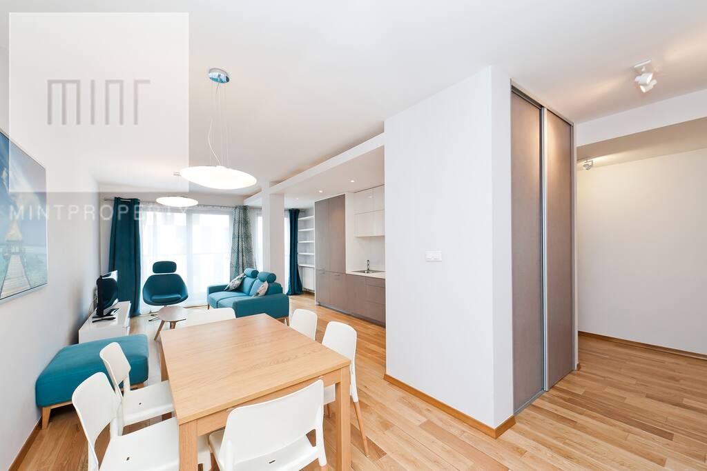 A living room connected with a kitchen