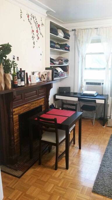 Another view of table chairs and desk in background