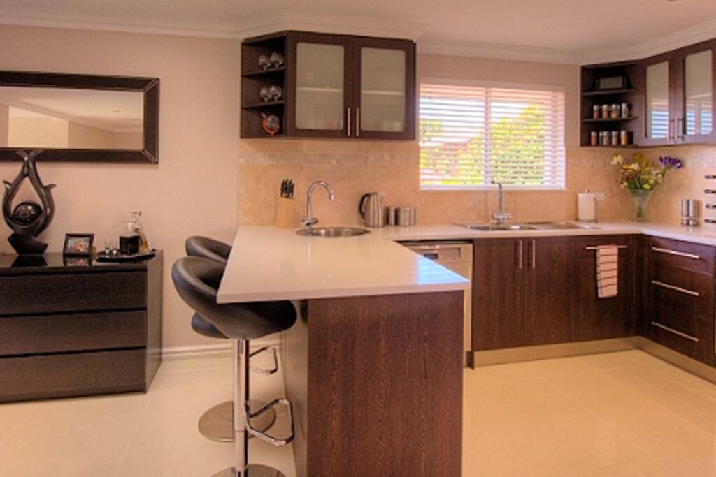 The stylish open-plan kitchen with breakfast bar