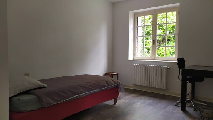 Ground floor bedroom with single bed and desk. 