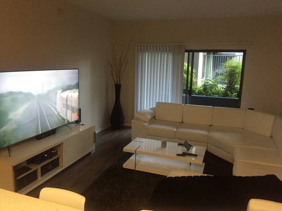 All modern furniture with 75" tv and surround sound. Huge balcony off the living room area that goes out to the pool. Super fast wifi and time warner tv package included!