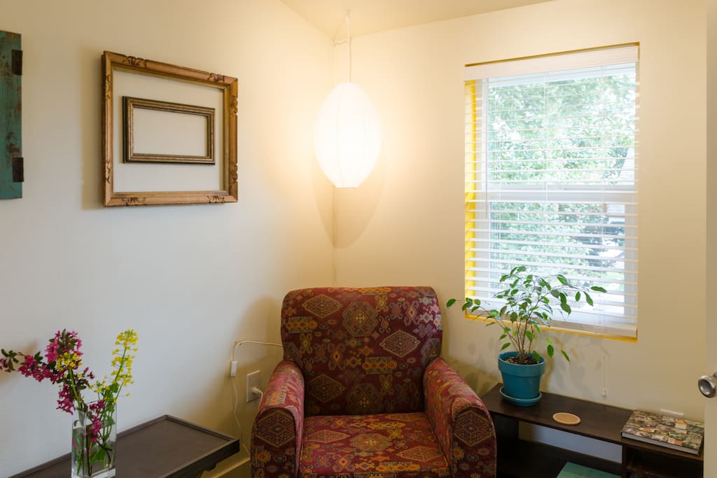 This sitting space in your bedroom is perfect for reading or planning your adventures -- comes with complete set of info about neighborhood restaurants, coffee/tea houses, & many other sites.