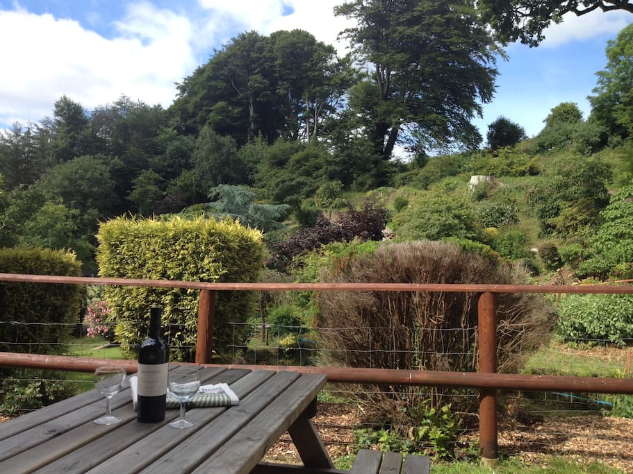 Outside dining area overlooking pond and tennis court