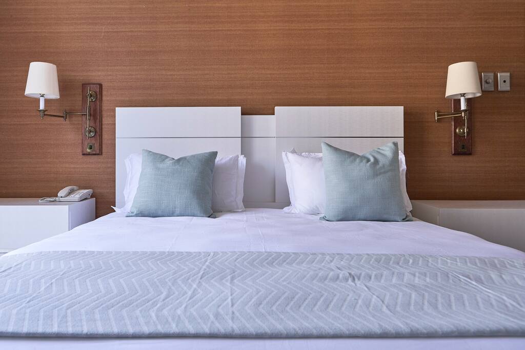 King XL bed with 300 thread count Egyptian cotton linen.