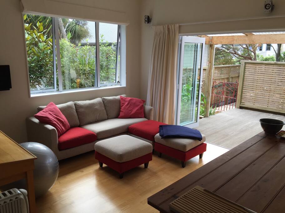 The lounge area, looking out ... (The ottomans can be put together to create another double bed in the lounge for a potential 3rd guest.)