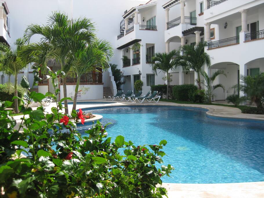 MAIN POOL WITH CHILDRENS POOL AND PARTY CABANA IN BACK GROUND