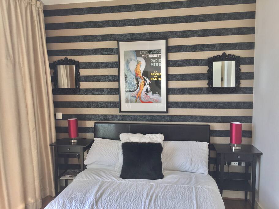 Double bedroom with balcony and city views