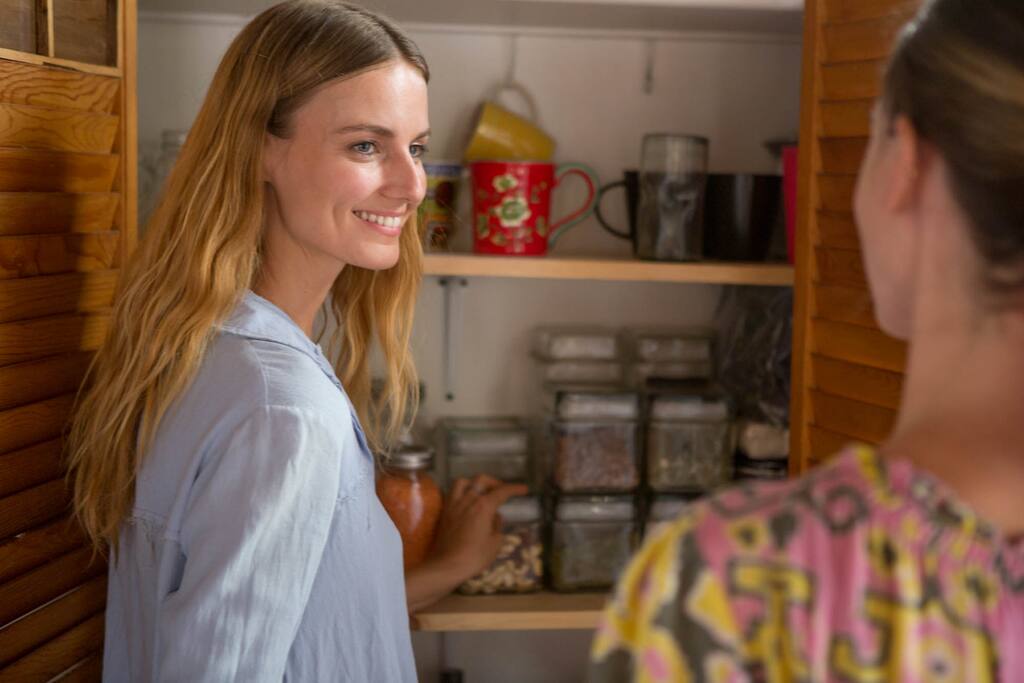 Colleen coaching a client in a healthier kitchen and cooking