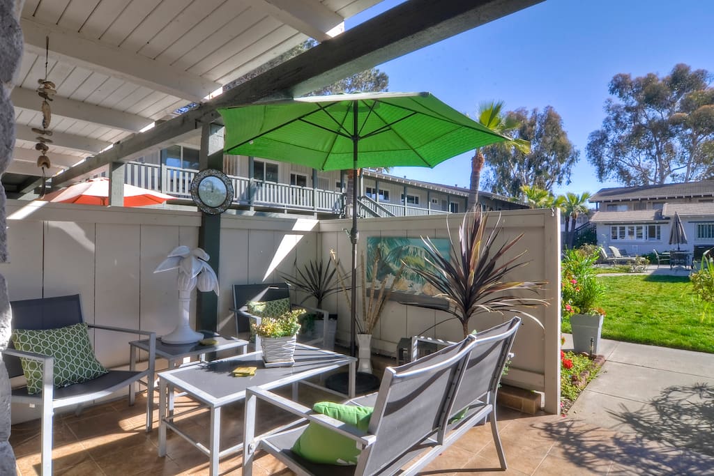 Relax on your own private front patio after a nice day at the beach