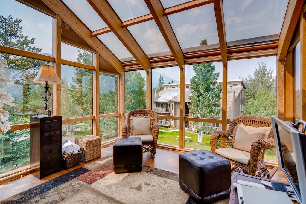 Enjoy panoramic views from the enclosed balcony in the living area