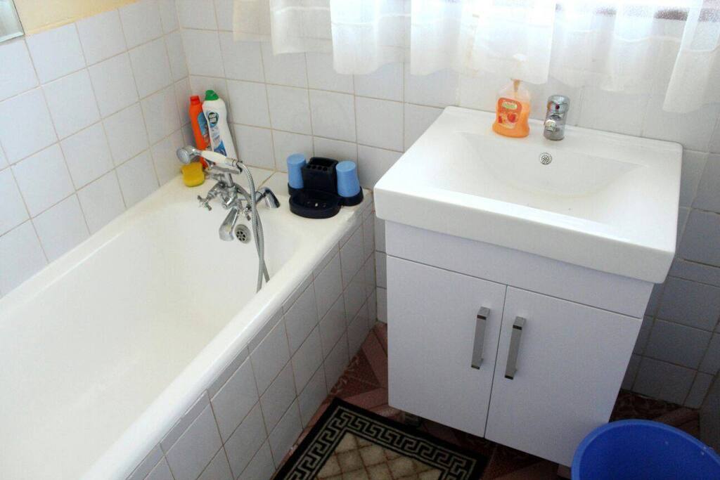 separate bathroom with showerhead