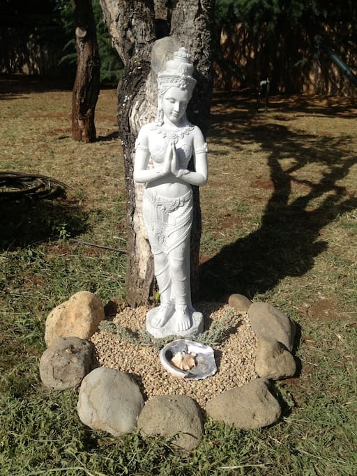 An angel will greet you every time you step out the living room door and into the garden.