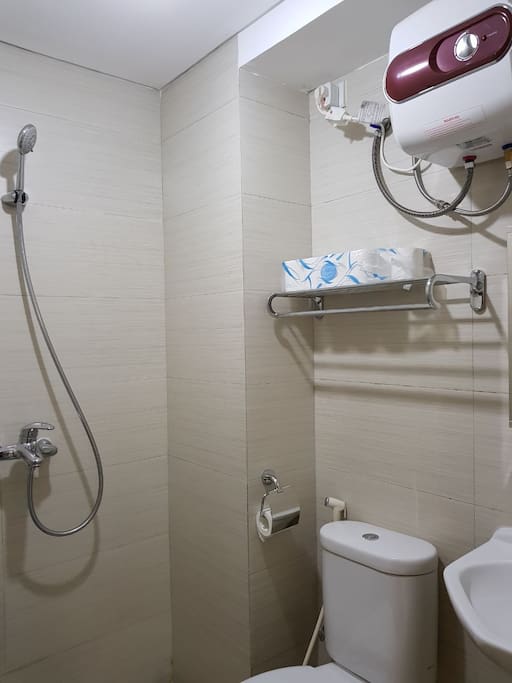 Bathroom with water heater and toiletries
