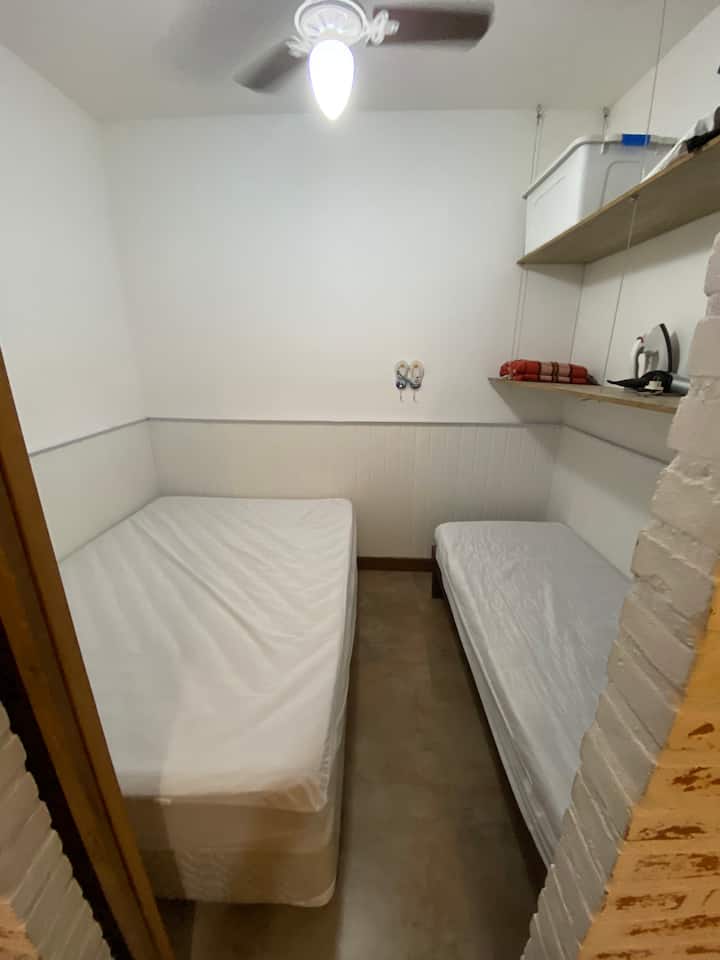 Bedroom with 1 double bed, 1 single bed, shelves and ceiling fan. ATTENTION! The room does not have windows.