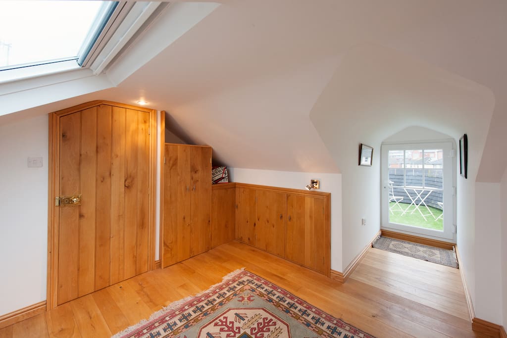 Door to room and roof terrace out back