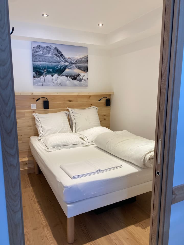 140 double bed in closed bedroom without window.