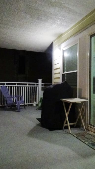 Front balcony facing toward ocean. Grill undercover