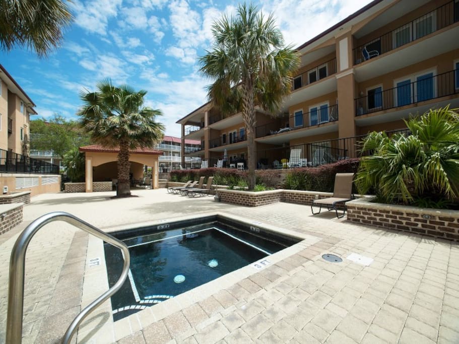 Enjoy the Swimming Pool and Spa with Abundant Deck Space, Lounge Chairs and Shaded Cabana