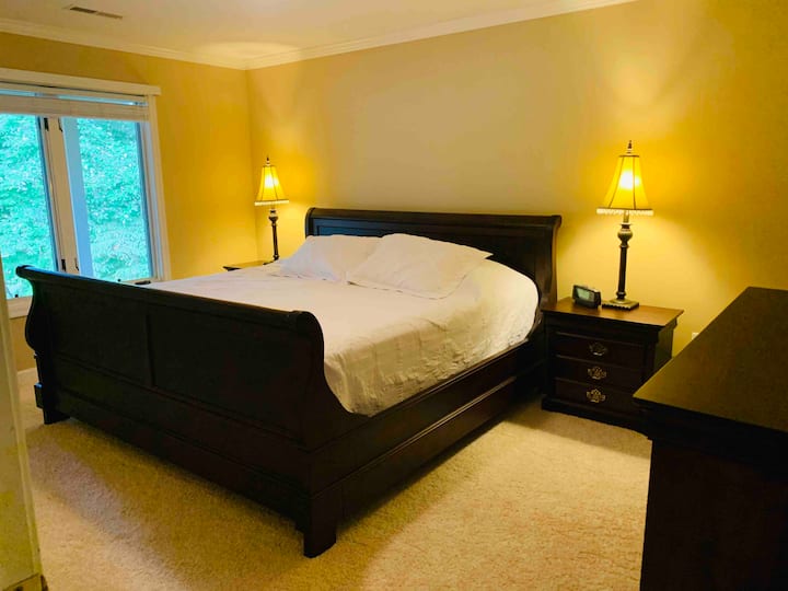 Lower level bedroom with king size bed. 