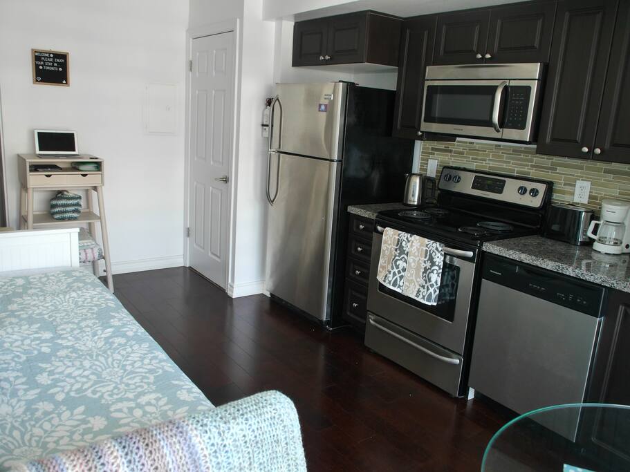 Galley kitchen with stainless steel appliances