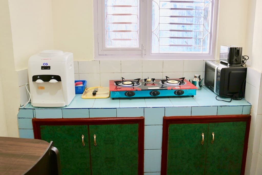 Sira I, has a shared kitchen where guests can cook their food and eat it joyfully. The Kitchen consists of Three-faced Gas Stove, a microwave, a water-kettle, a refrigerator, sink, and a small dining.