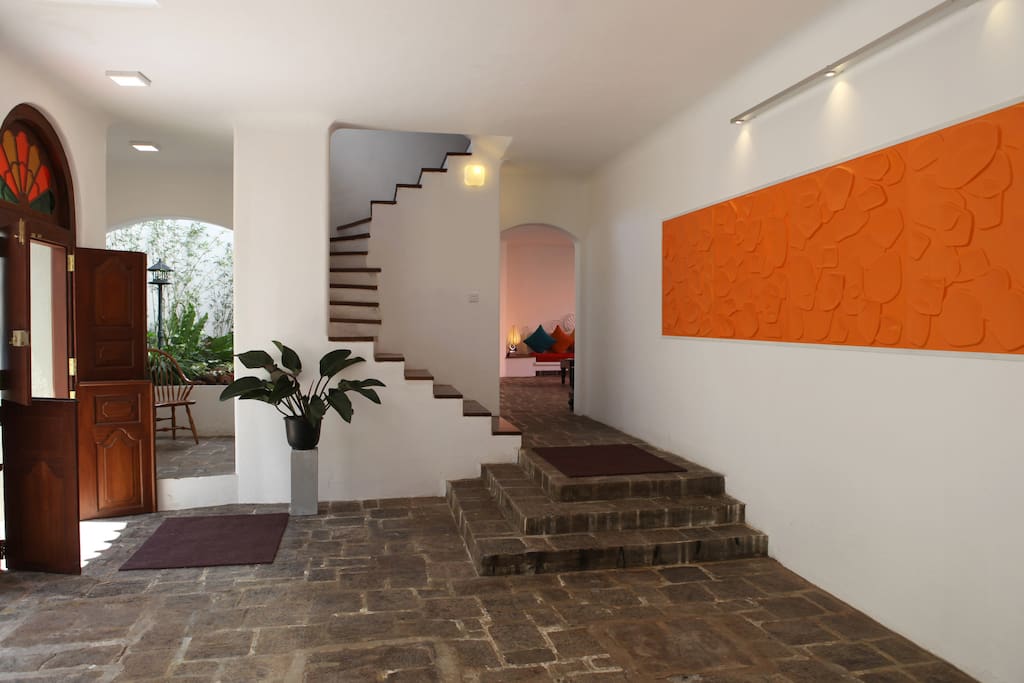 This is the Entrance to the premises, The main doorway are made of solid local timber dating back to C. 1900 ,and belongs to the original design of the house. The floors are adorned with solid black stone mined from the rocky terrain of Sri Lanka
