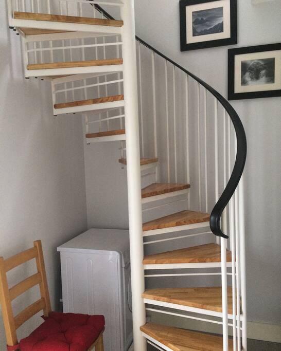 Spiral staircase to the open plan dining and kitchen area