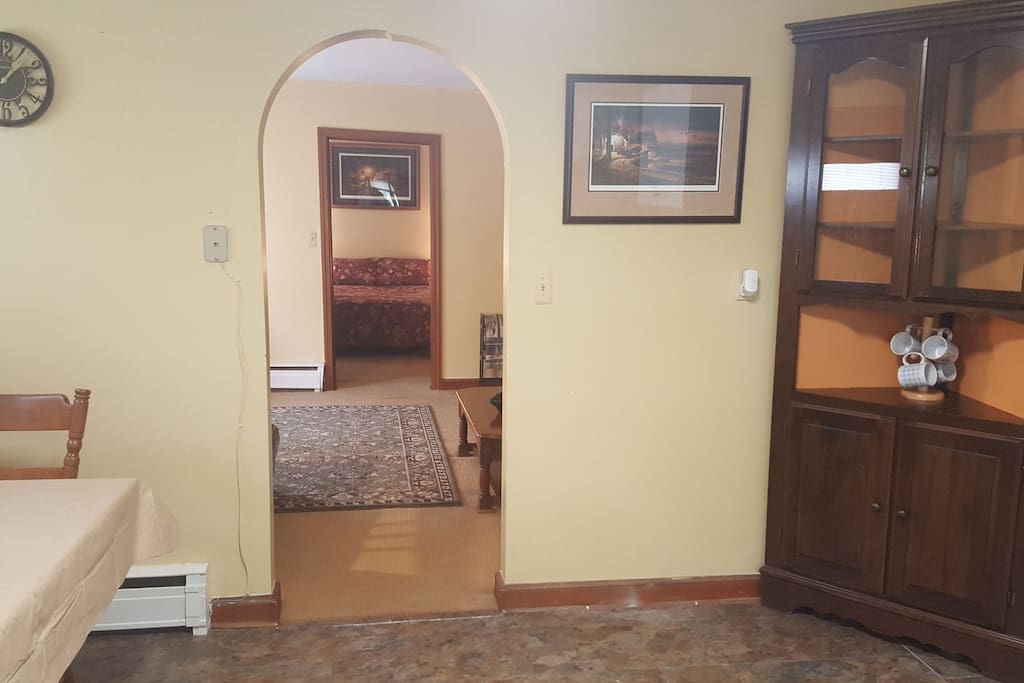 looking from kitchen, through livingroom into bedroom