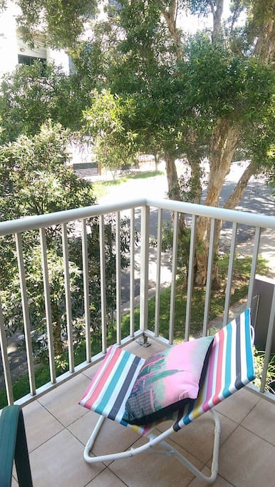 personal balcony surrounded by trees