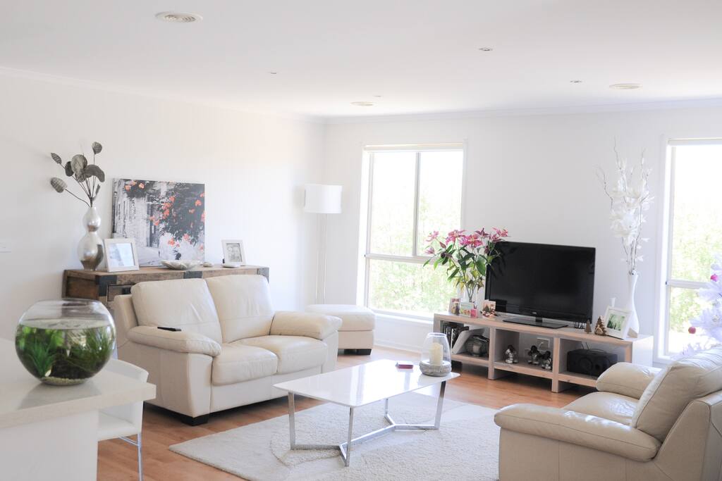 Main living area. adjacent to this is a huge rumpus room with cinema TV, surround sound, piano and games.