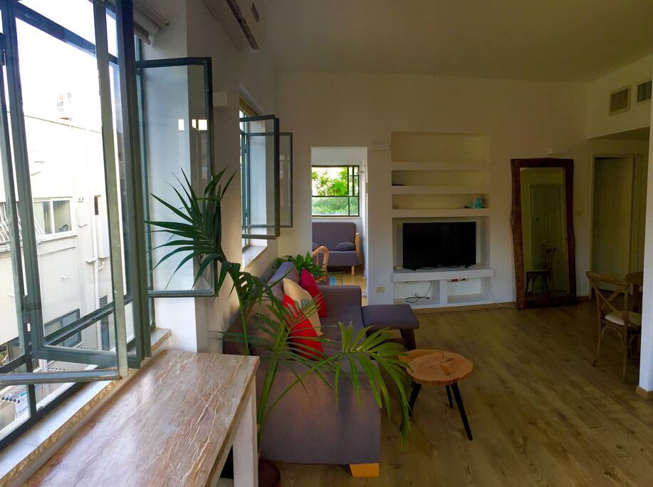 Bright, sunny and spacious living room and kitchen.
