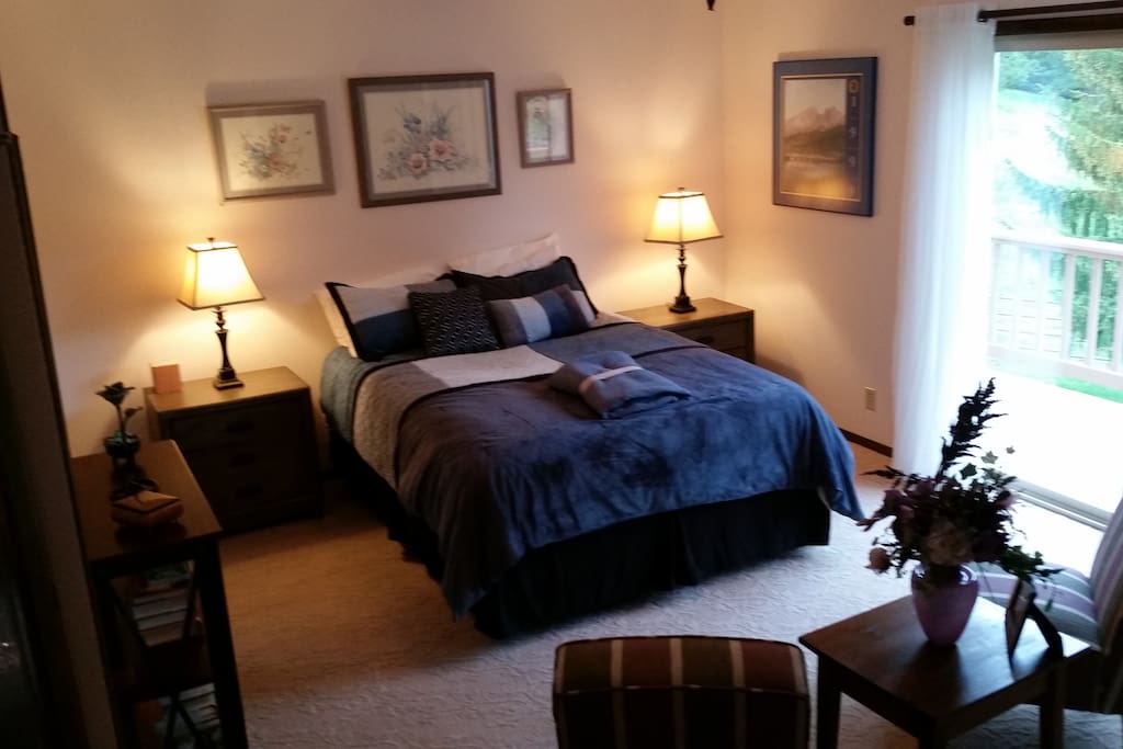 Queen Bed with room facing east. Enjoy your morning coffee on the deck