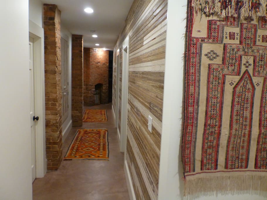 The hallway, lined with brick and repurposed bead board.