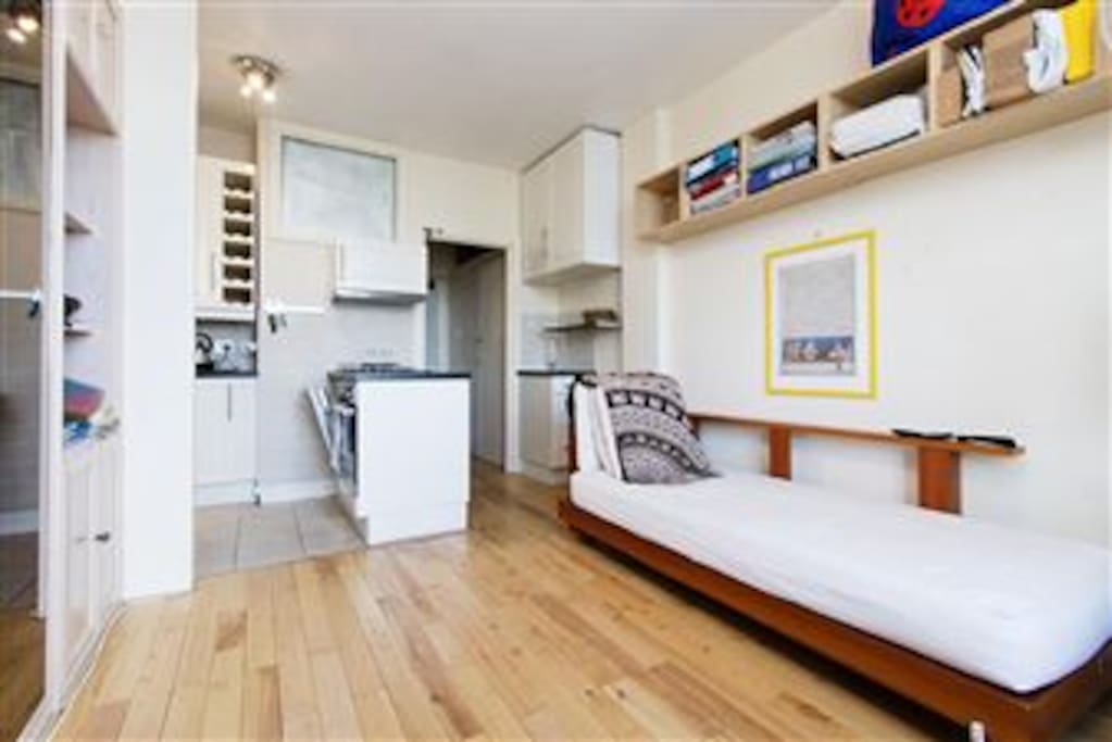 open plan kitchen with washer/dryer, fridge/freezer/dishwasher, electric oven & hob.