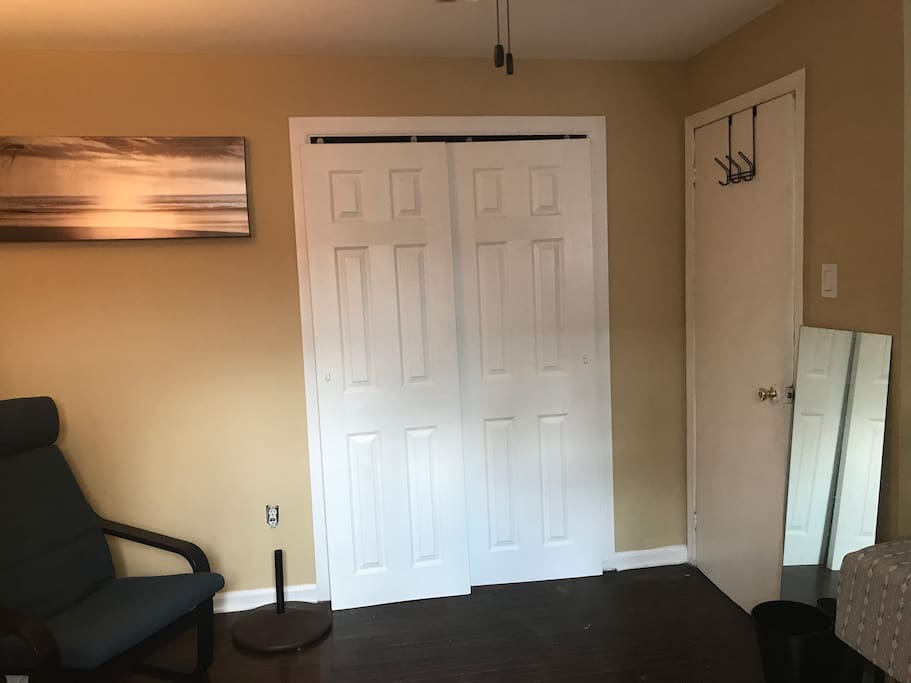 View of full closet + bedroom door