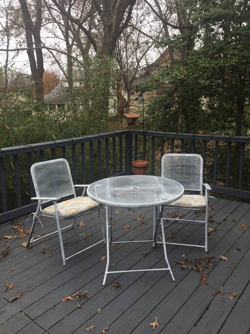 Large deck overlooking fenced backyard