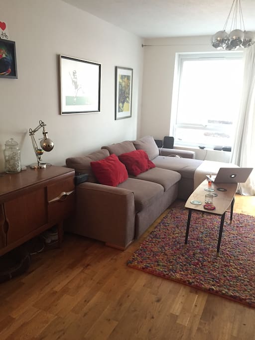 Large comfy sofa and retro side-board.