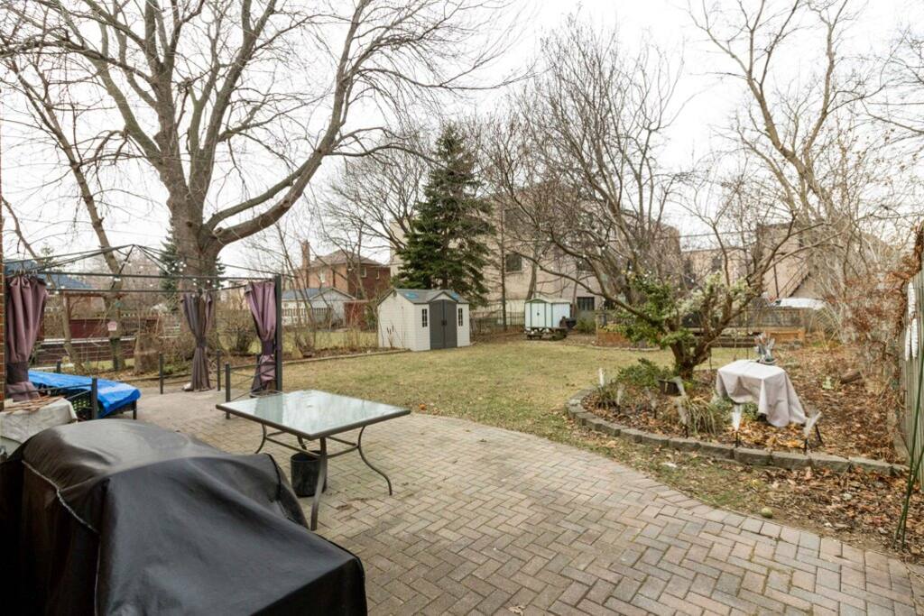 Backyard with patio table and chairs.