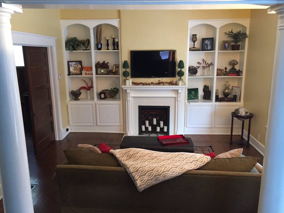 A spacious and comfortable living room equipped with netflix and cable.