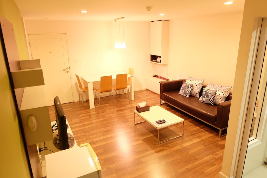 Living Area: a dining and/or working table with four chairs, an ultra hi-speed internet (Wi-Fi) connection & a wireless router (placed on the lower cupboard adjacent to the sofa), a dust bin and upper & lower cupboards.