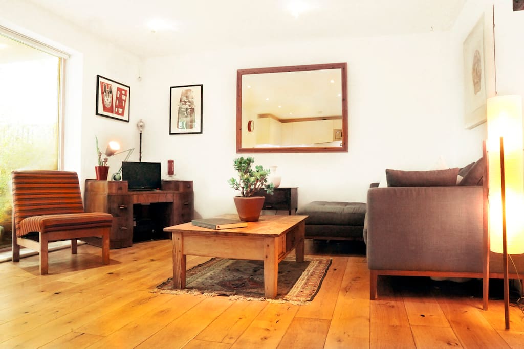 Open plan living room is lovely and brightthanks to the large windows