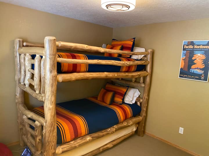 Third bedroom with adult sized bunk beds and pull out trundle sleeps three